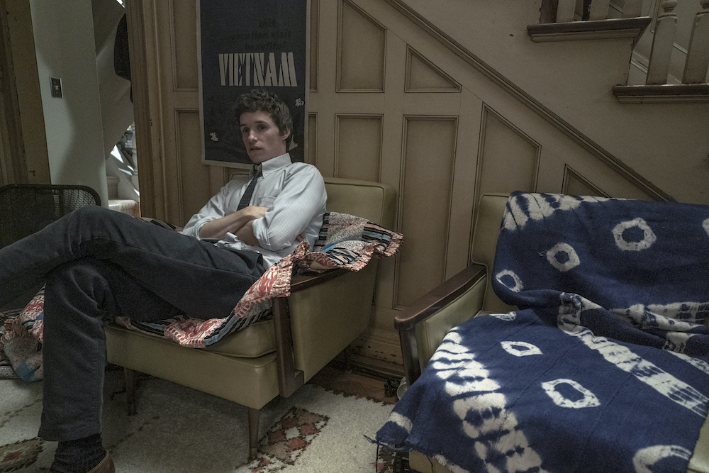 Eddie Redmayne as Tom Hayden in The Trail of the Chicago 7